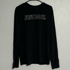 It’s a medium, black Nike long sleeve, it says just do it on the front.